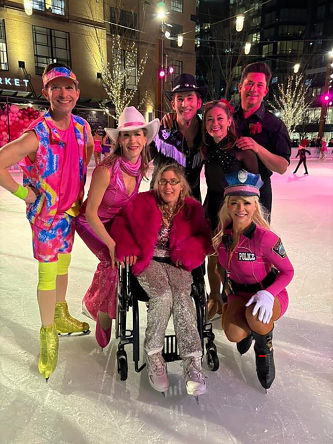 Marina Shelton, dressed in pink, is with castmates for the on-ice production of Barbie on Ice.of 