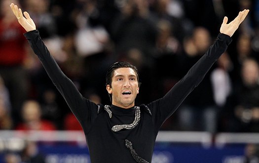 Evan Lysacek ends his program with arms outstretched towards the crowd.