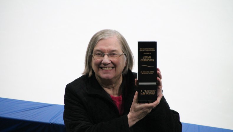 Synchro team manager Gail holds up a box.