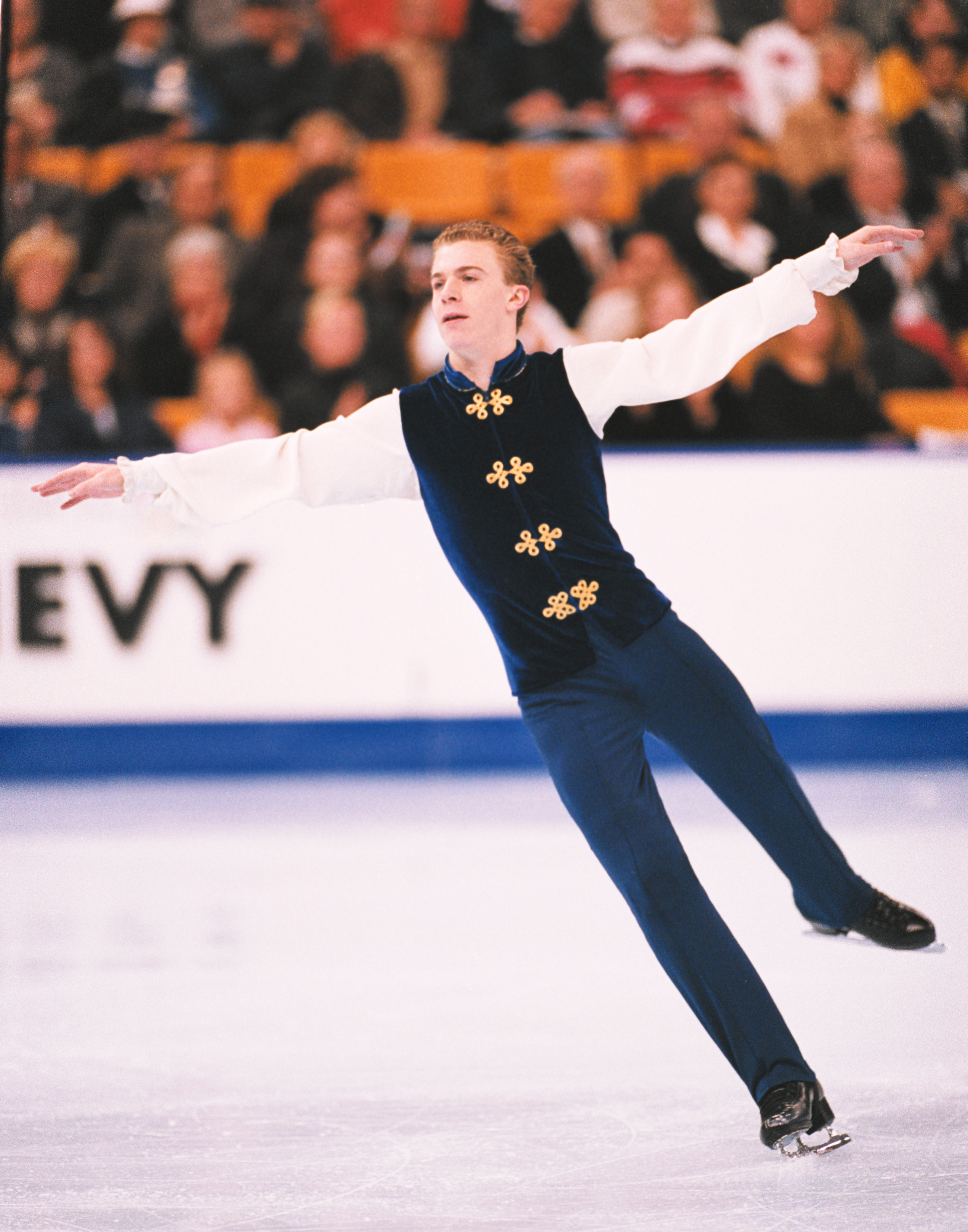 Timothy Goebel competing in an indoor rink.