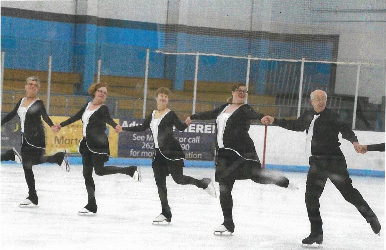 The Eble Elite Edges practice at the rink in a line.