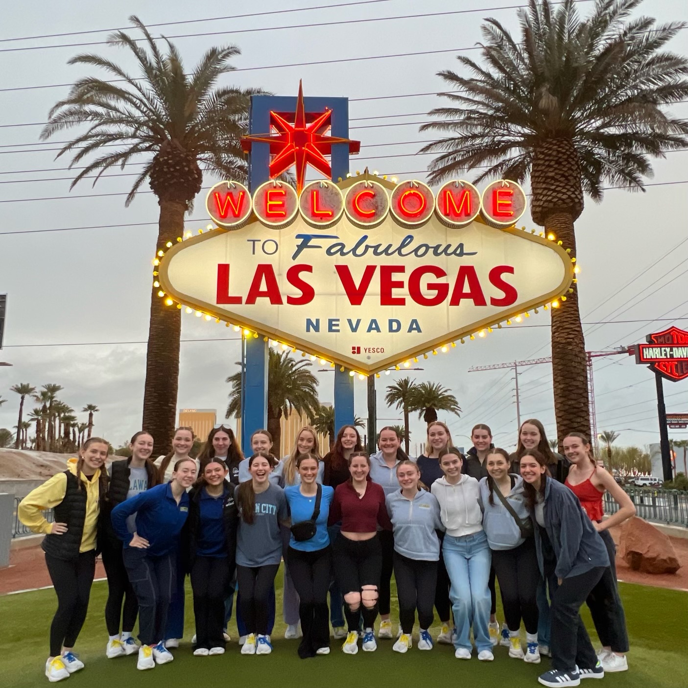 University of Delaware stands in front of iconic Las Vegas sign. 