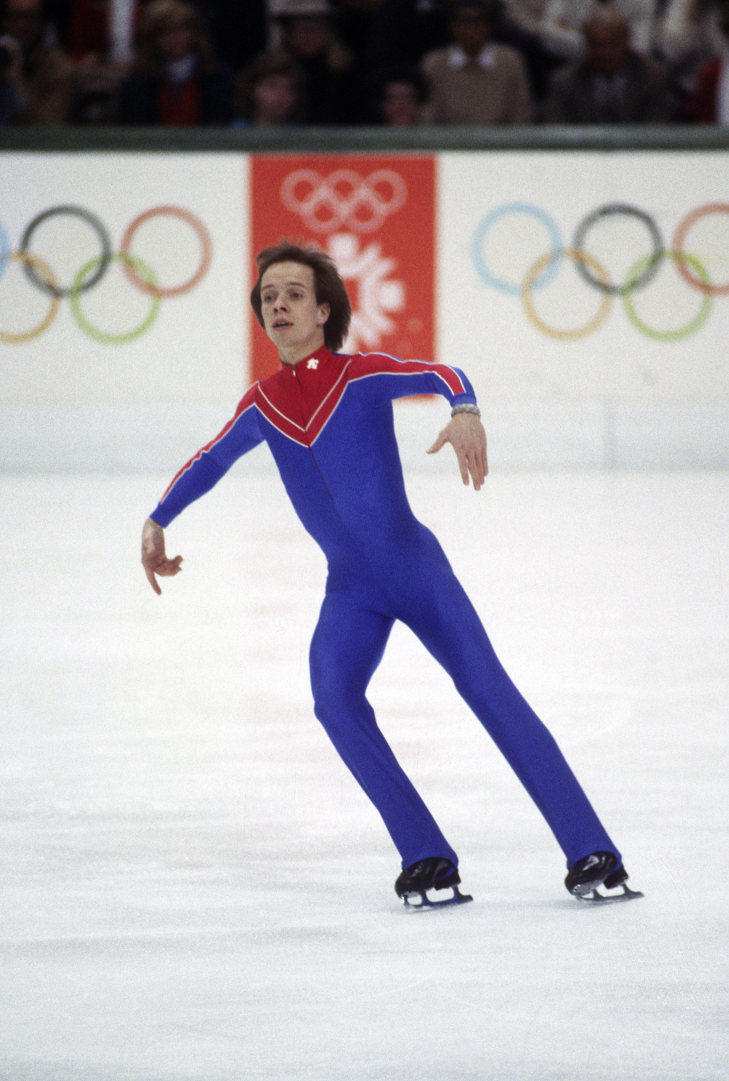 Scott Hamilton in his iconic blue and red jumpsuit during the Olympics.