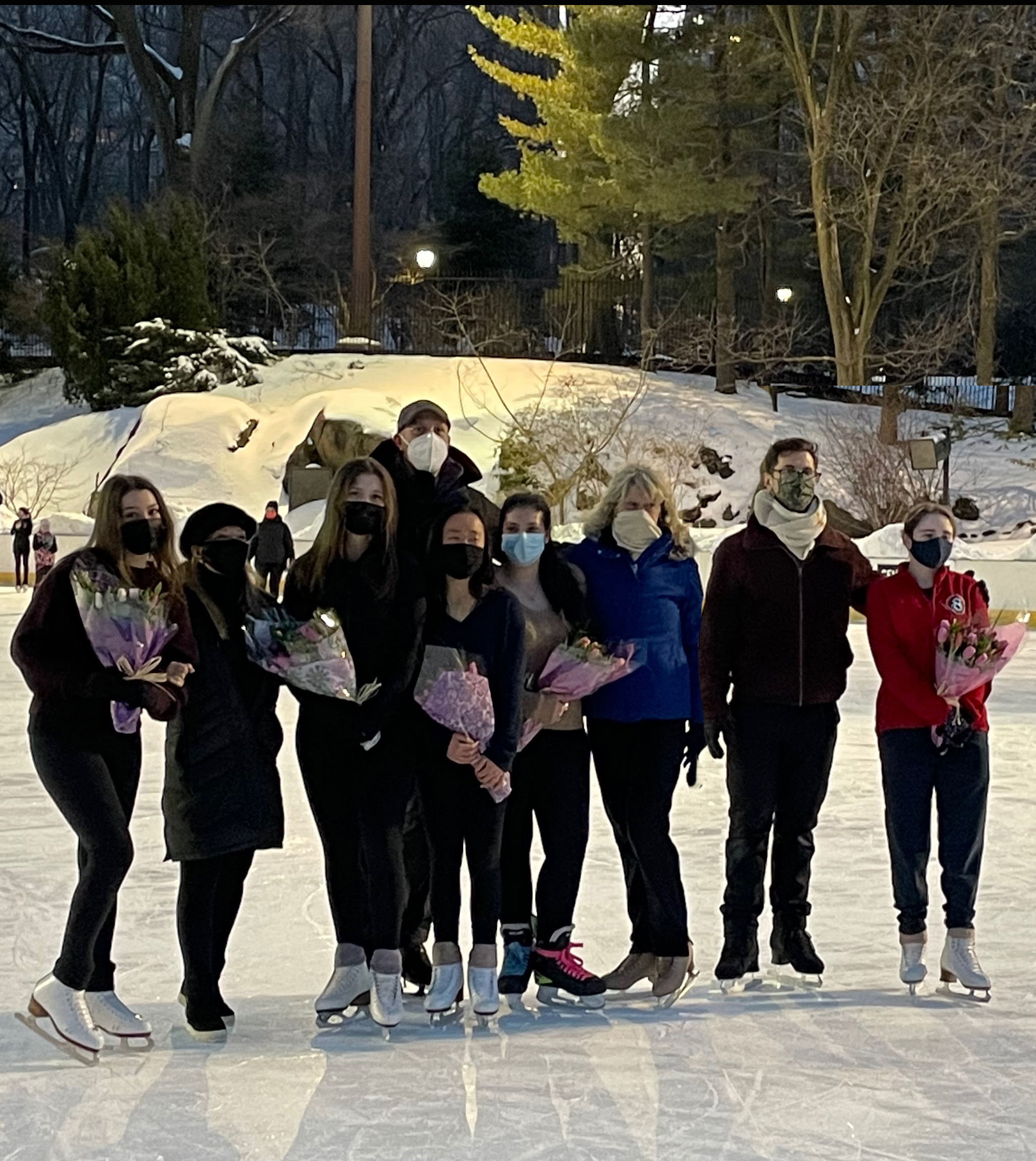 A group of skaters pose together. 