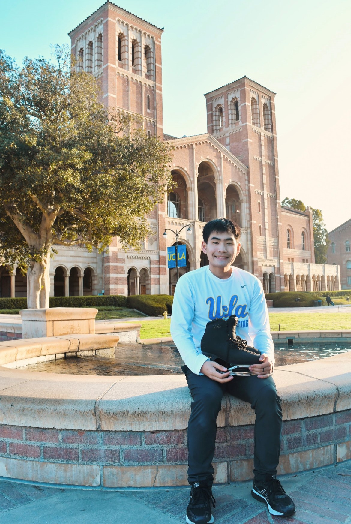 Goku Endo sits with his skate on the campus of UCLA.