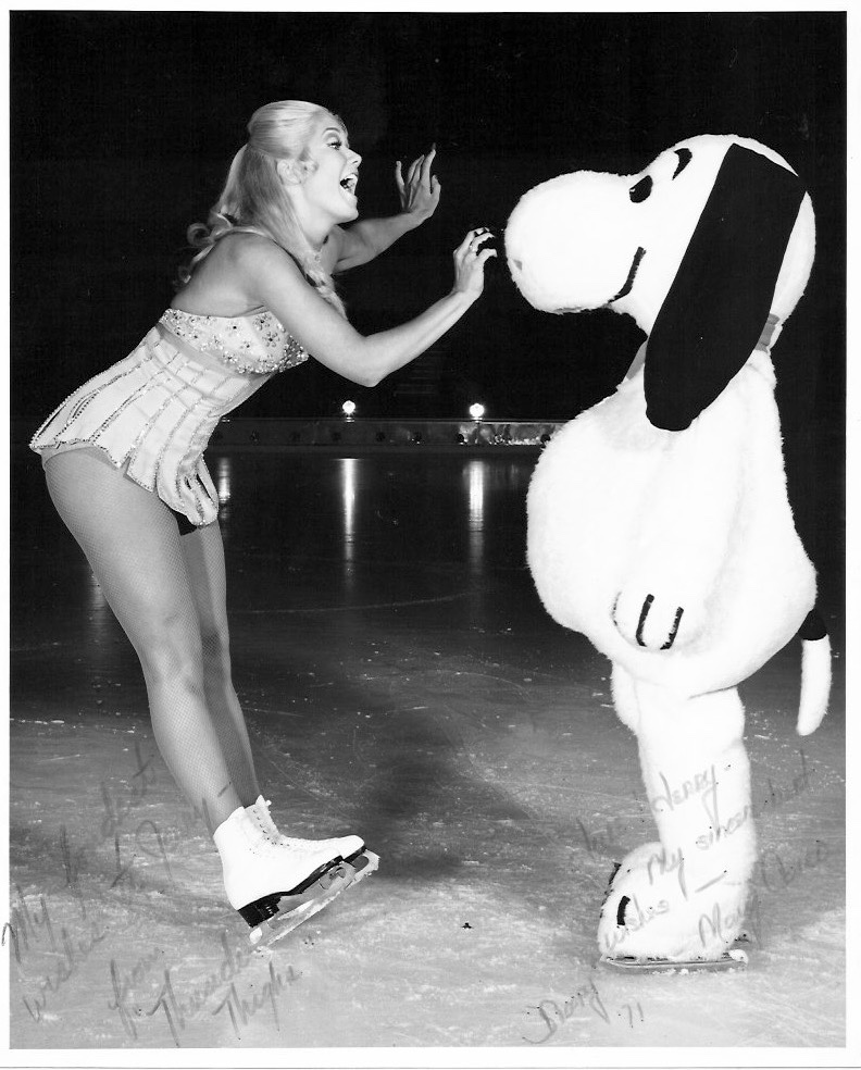 Karen Kresge on the ice with Snoopy, taken in black and white.