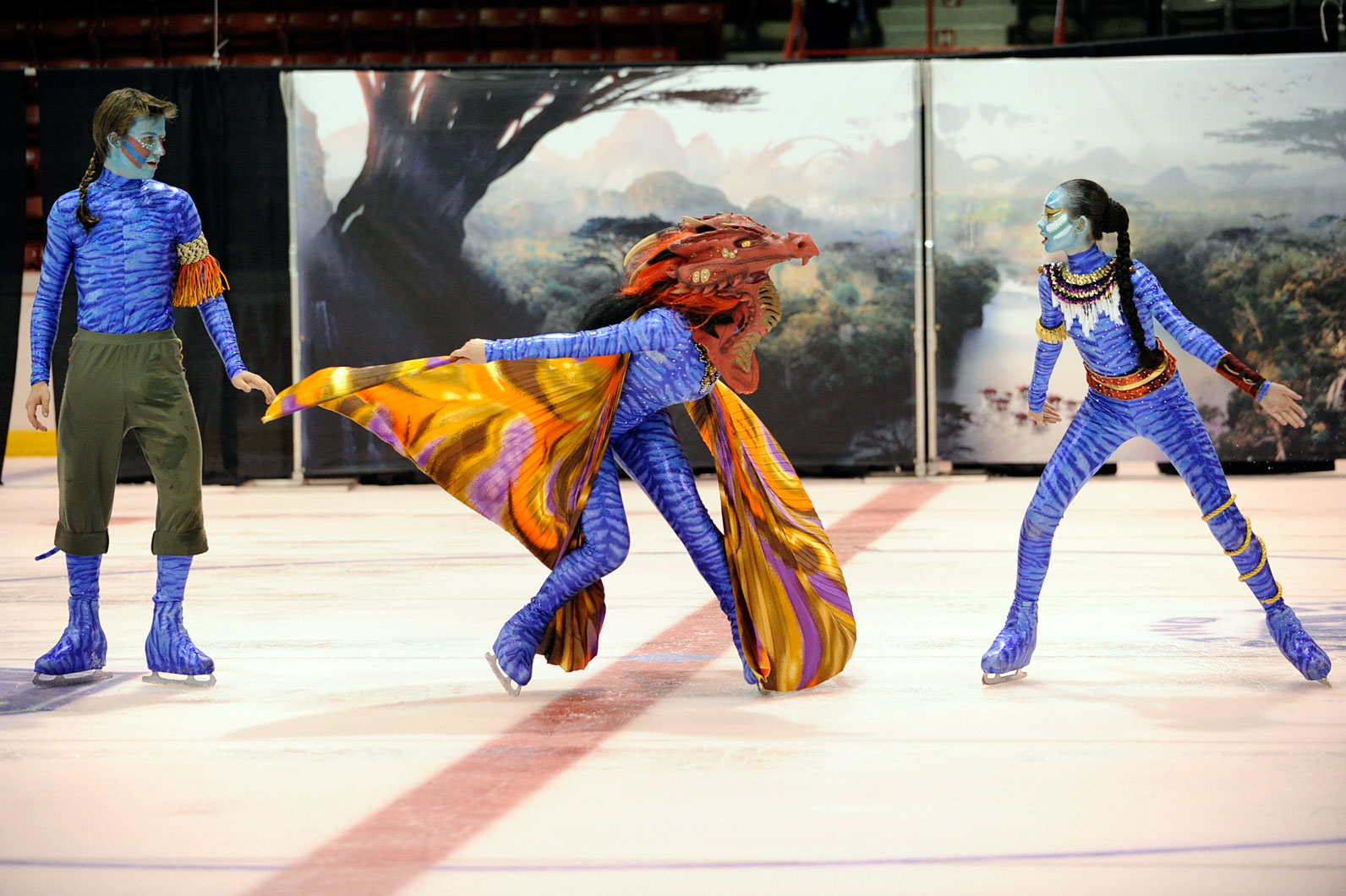 Los Angeles Theatre Senior team competes an Avatar program with blue costumes and orange wings.