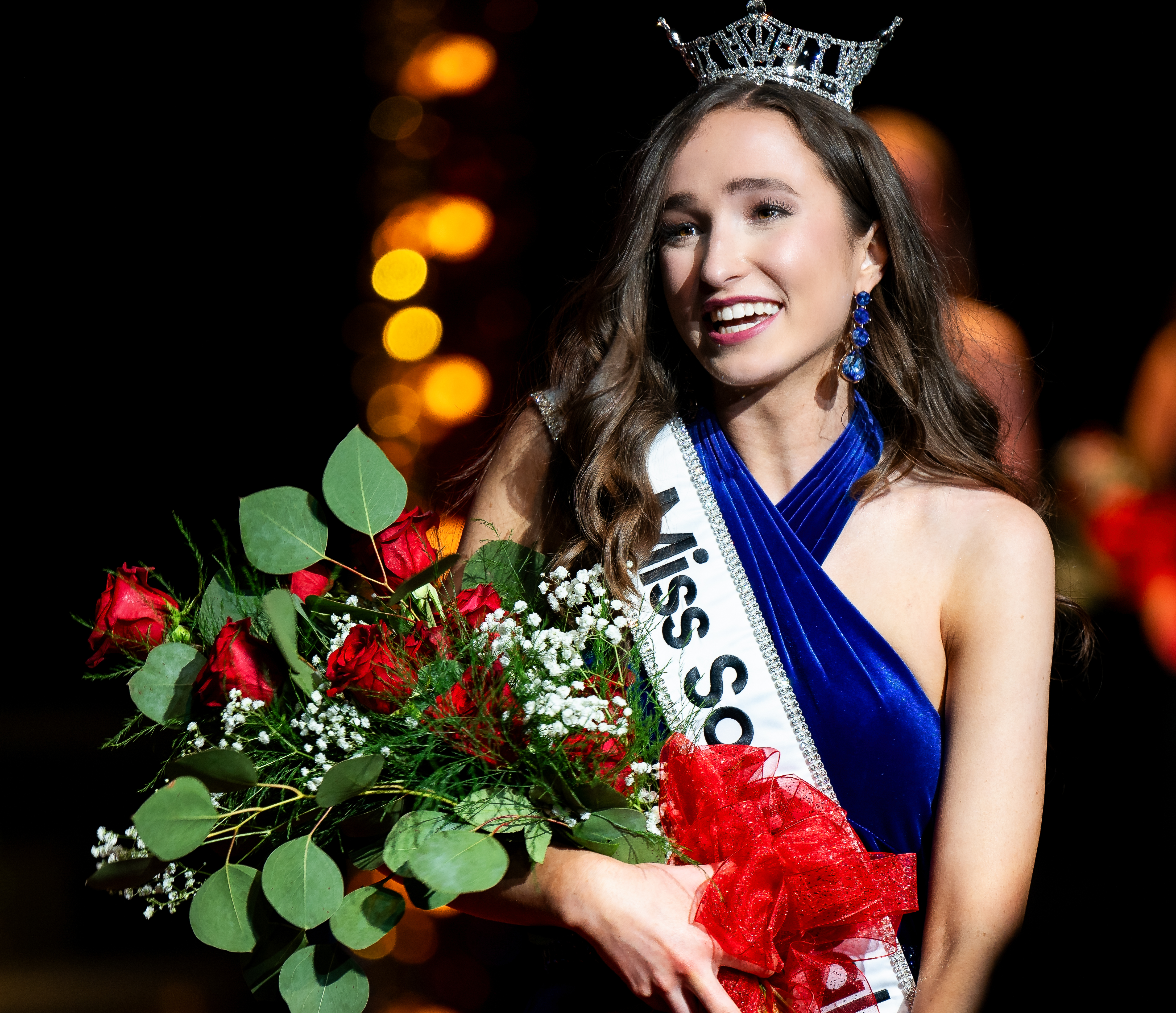 Wearing dark blue and a tiara, Joelle Simpson is crowned Miss South Dakota.