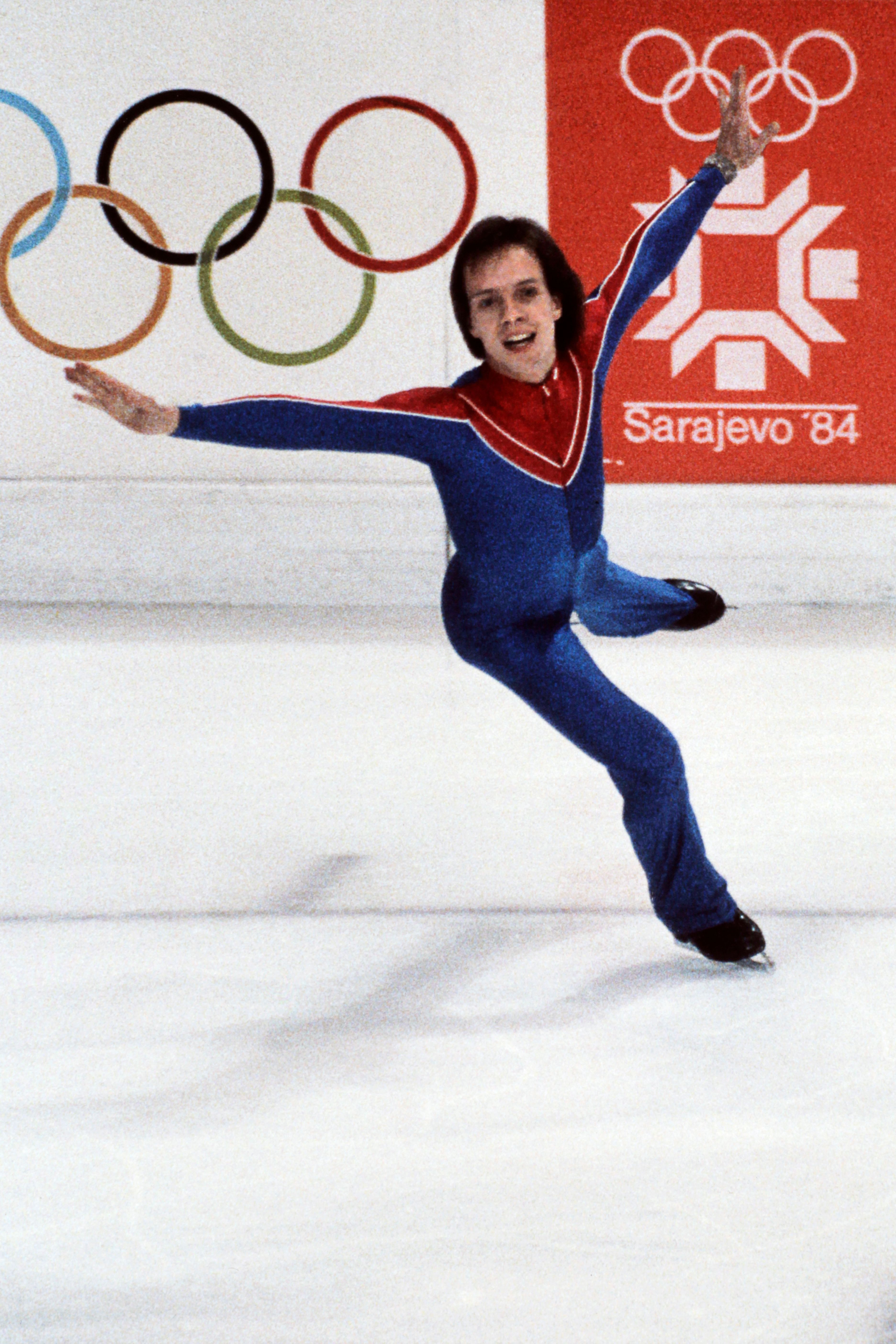 Scott Hamilton of the United States smiles as he performs during the men's figure skating free program 16 February 1984 in Sarajevo. Hamilton won the gold medal in front of Canadian Brian Orser (silver) and Czech Josef Sabovcik (bronze)