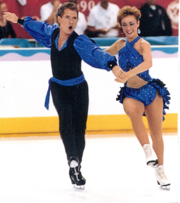 Susan and Joseph compete together wearing matching blue and black costumes