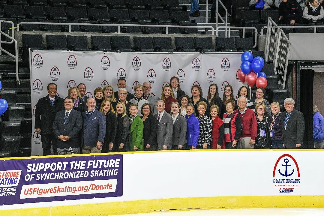 A legacy photo in the kiss and cry of those involved with synchronized skating throughout the years.