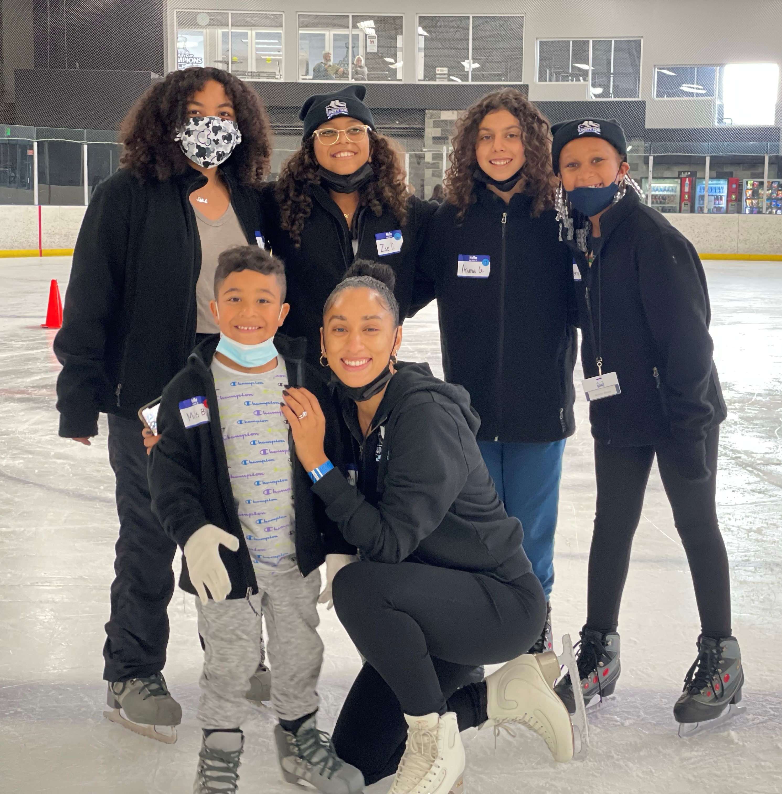 Ashleigh Ellis poses with a group of skaters at the 2022 Unity Ice Academy Summer Camp