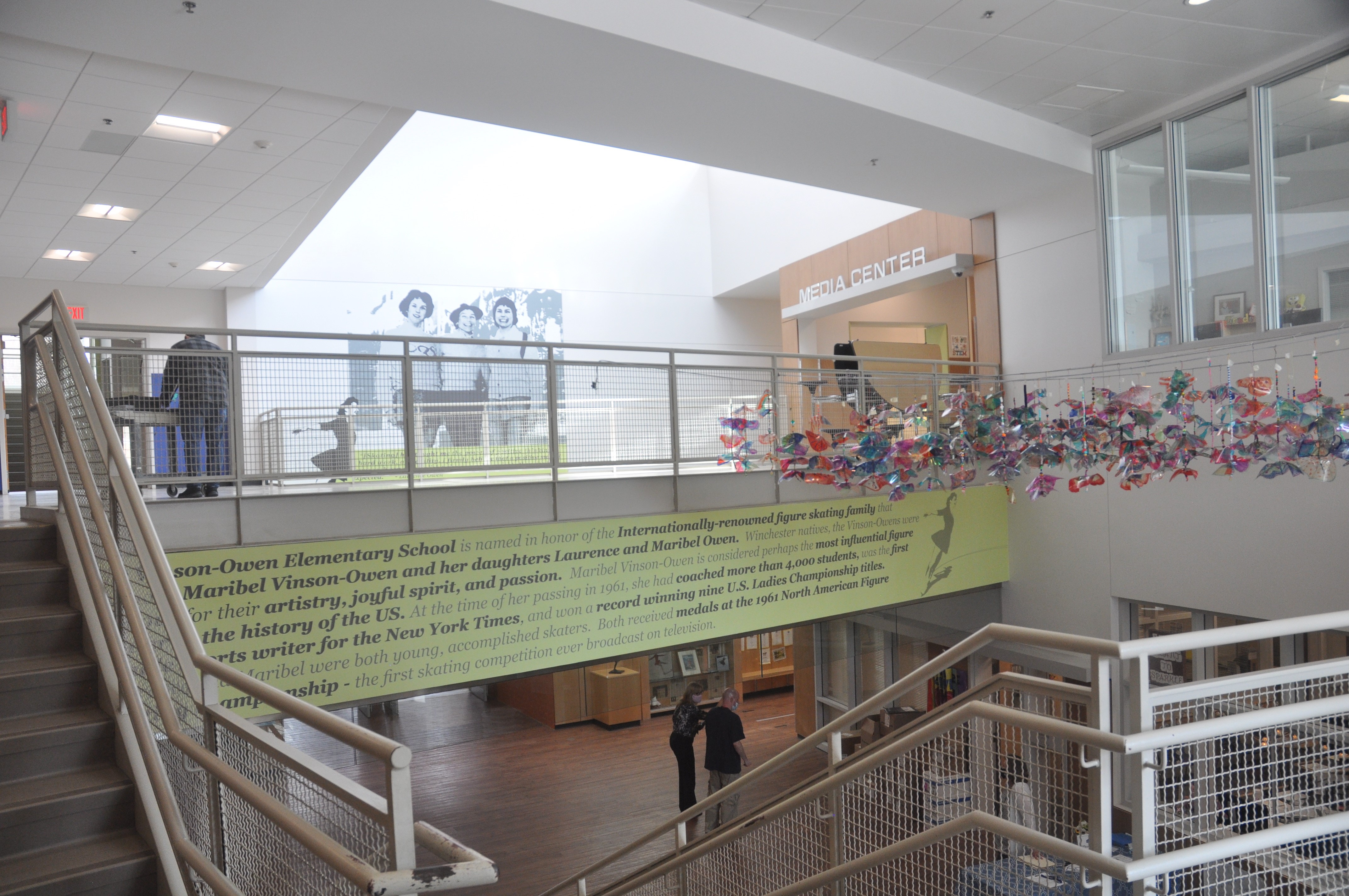 Inside the Vinson-Owen Elementary School, a lime green word mural highlights Maribel's accomplishments.