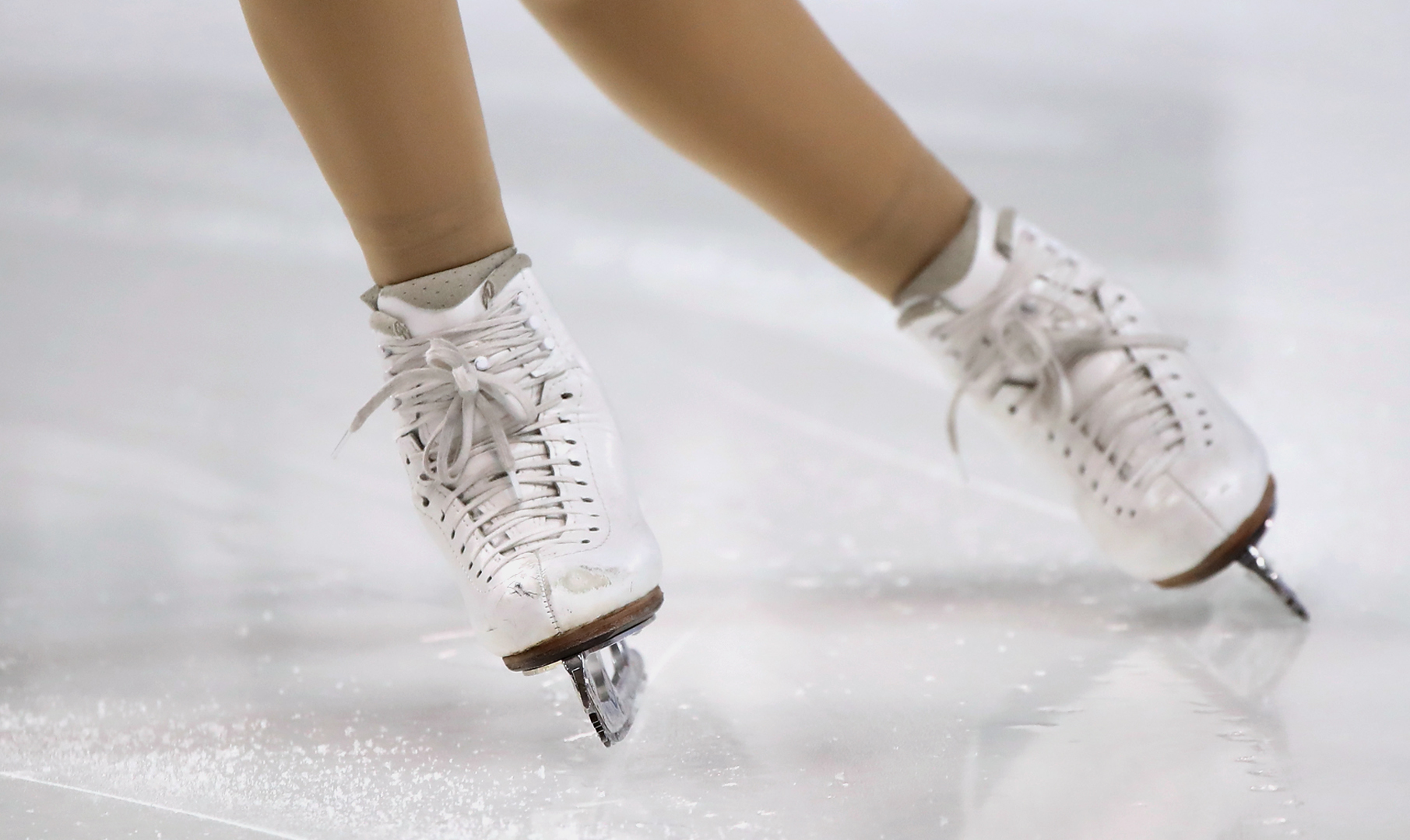 Skater with blades on ice.