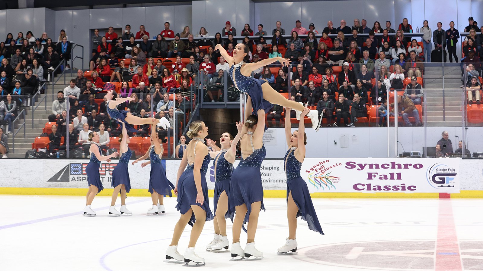 The Skyliners perform two lifts, with one skater above each group.