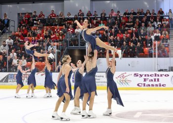 The Skyliners perform two lifts, with one skater above each group.