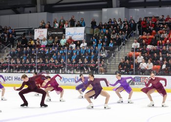 Bent at the waist, not touching, the Haydenettes demonstrate their unison.